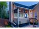 Inviting screened porch with cozy seating and peaceful backyard views at twilight at 150 Lystra Ridge Rd, Chapel Hill, NC 27517