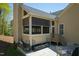 Relaxing screened porch with comfortable seating, wood storage, and outdoor patio at 150 Lystra Ridge Rd, Chapel Hill, NC 27517