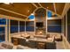 Warm sunroom features stone fireplace, high vaulted ceiling, and neutral furnishings at 150 Lystra Ridge Rd, Chapel Hill, NC 27517