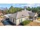An inviting amenity center featuring a pool, stone accents, and a comfortable outdoor lounge area at 154 Alamosa Pl, Cary, NC 27519