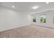 A bright bedroom with plush carpet, natural light, and a relaxing atmosphere at 154 Alamosa Pl, Cary, NC 27519