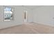 Bright bedroom with neutral carpet, a large window, and an ensuite bath at 154 Alamosa Pl, Cary, NC 27519