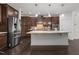 Well-equipped kitchen with stainless steel appliances, granite countertops, and ample cabinet space at 154 Alamosa Pl, Cary, NC 27519