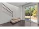 Open living area with staircase leading to a sliding glass door to the outdoor at 154 Alamosa Pl, Cary, NC 27519