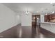 Open-concept living space featuring hardwood floors and a view of the modern kitchen at 154 Alamosa Pl, Cary, NC 27519