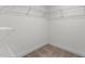 Well-organized walk-in closet equipped with multiple racks for efficient storage at 154 Alamosa Pl, Cary, NC 27519