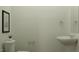 Bathroom featuring a toilet, sink, and minimalist design at 1543 Crescent Townes Way, Raleigh, NC 27604