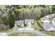 An aerial view of two homes with manicured lawns and lush trees behind the homes at 1808 W Cotton Gin Dr, Clayton, NC 27527
