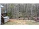 Secluded backyard space backing up to a serene wooded area offering privacy at 1808 W Cotton Gin Dr, Clayton, NC 27527