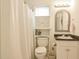 Cozy bathroom with a vanity, toilet, and shower with curtain at 1808 W Cotton Gin Dr, Clayton, NC 27527