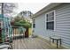 View of the backyard deck with stairs and a table with decorations at 1808 W Cotton Gin Dr, Clayton, NC 27527