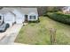 Charming home with an attached garage, landscaped yard, and well-maintained lawn at 1808 W Cotton Gin Dr, Clayton, NC 27527