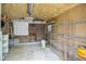 A storage area with metal shelving and a brick accent wall at 1808 W Cotton Gin Dr, Clayton, NC 27527