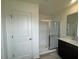 Bathroom with a shower featuring a glass door, vanity, and modern fixtures at 190 Chestnut Oak Ln, Lillington, NC 27546