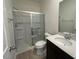 Well-lit bathroom featuring a glass-enclosed shower and modern fixtures at 190 Chestnut Oak Ln, Lillington, NC 27546