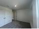 This bedroom features a closet, gray carpet, and white walls at 190 Chestnut Oak Ln, Lillington, NC 27546