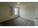 This bedroom has gray carpet, a window, and white walls at 190 Chestnut Oak Ln, Lillington, NC 27546