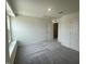 This bedroom has gray carpet, white walls, and a window at 190 Chestnut Oak Ln, Lillington, NC 27546