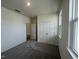 This bedroom has a double door closet and carpet flooring at 190 Chestnut Oak Ln, Lillington, NC 27546