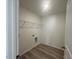 Bright laundry room with hookups and shelving for organization and storage at 190 Chestnut Oak Ln, Lillington, NC 27546