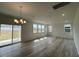 Spacious living room filled with natural light, featuring hardwood floors at 190 Chestnut Oak Ln, Lillington, NC 27546