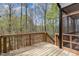 Wooden deck with railing and stairs overlooking a wooded landscape at 191 W Cultivator Way, Clayton, NC 27520