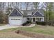 Charming exterior view of the home, well-manicured lawn and landscaping at 191 W Cultivator Way, Clayton, NC 27520