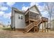 Rear exterior view with a screened porch, deck, solar panels and siding at 191 W Cultivator Way, Clayton, NC 27520