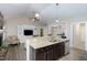 Kitchen area featuring granite countertops, stainless steel dishwasher, and view of the living room at 191 W Cultivator Way, Clayton, NC 27520