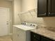Functional laundry room with washer, dryer, storage and door to the exterior at 191 W Cultivator Way, Clayton, NC 27520