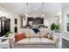 Open-concept living room flows into kitchen, with breakfast bar and view to backyard at 191 W Cultivator Way, Clayton, NC 27520