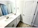 Bathroom with a double sink vanity and modern fixtures at 193 Falls Of The Cape Dr, Lillington, NC 27546