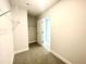 This carpeted walk-in closet includes wire shelving at 193 Falls Of The Cape Dr, Lillington, NC 27546