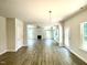 Spacious living room with hard surface floors and neutral paint overlooks the entry and back patio at 193 Falls Of The Cape Dr, Lillington, NC 27546