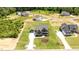 An aerial view showcases this modern home, detached garage and the expansive green lawn at 20 Serenity Woods Trl, Franklinton, NC 27525