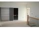 Upstairs landing features staircase, a closet, and attic access at 20 Serenity Woods Trl, Franklinton, NC 27525