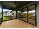 Covered back porch with a ceiling fan, sliding glass door access, and backyard views at 20 Serenity Woods Trl, Franklinton, NC 27525