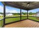 Beautiful back porch with ceiling fan and a lovely view of the backyard and green trees at 20 Serenity Woods Trl, Franklinton, NC 27525