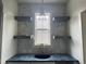 Stylish bar area featuring floating shelves, elegant backsplash, and a modern pendant light at 20 Serenity Woods Trl, Franklinton, NC 27525