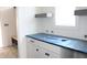 Bathroom featuring a new countertop over painted white cabinets with modern fixtures and ample storage at 20 Serenity Woods Trl, Franklinton, NC 27525