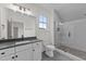 Modern bathroom featuring a glass-enclosed shower, sleek vanity with dark countertops, and contemporary finishes at 20 Serenity Woods Trl, Franklinton, NC 27525