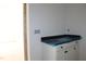 Bathroom vanity with black countertop and white cabinets at 20 Serenity Woods Trl, Franklinton, NC 27525
