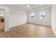 Bright bedroom with two windows and wood-look floors at 20 Serenity Woods Trl, Franklinton, NC 27525