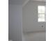 Bright bedroom with natural light streaming through a window at 20 Serenity Woods Trl, Franklinton, NC 27525