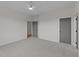 Spacious bedroom with neutral walls, carpet, a ceiling fan and modern gray doors at 20 Serenity Woods Trl, Franklinton, NC 27525