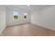 Bright bedroom with two windows and wood-look floors at 20 Serenity Woods Trl, Franklinton, NC 27525