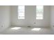 Bright bedroom with natural light streaming through two large windows at 20 Serenity Woods Trl, Franklinton, NC 27525