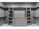 Walk-in closet featuring shelving and a center island at 20 Serenity Woods Trl, Franklinton, NC 27525