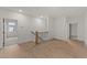 Hallway with wood-look floors and white walls at 20 Serenity Woods Trl, Franklinton, NC 27525