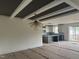 Open-concept living room and kitchen with tray ceiling, unique lighting fixtures, and natural light at 20 Serenity Woods Trl, Franklinton, NC 27525